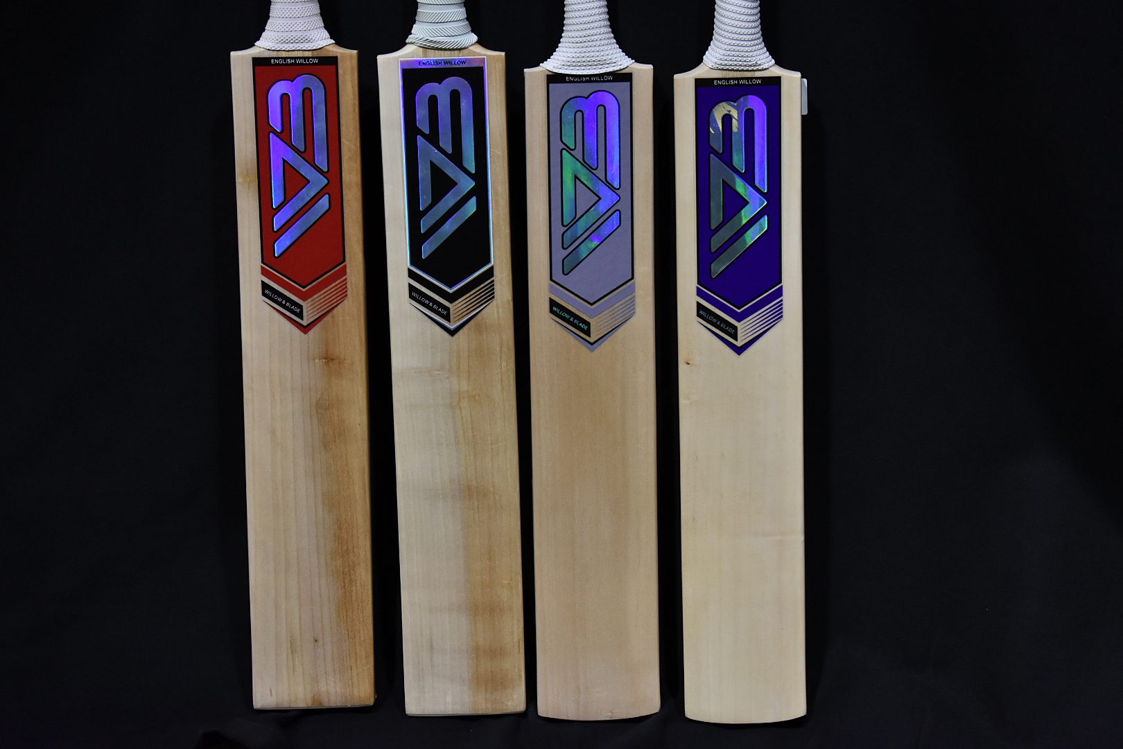 The faces of four Willow & Blade English willow bats