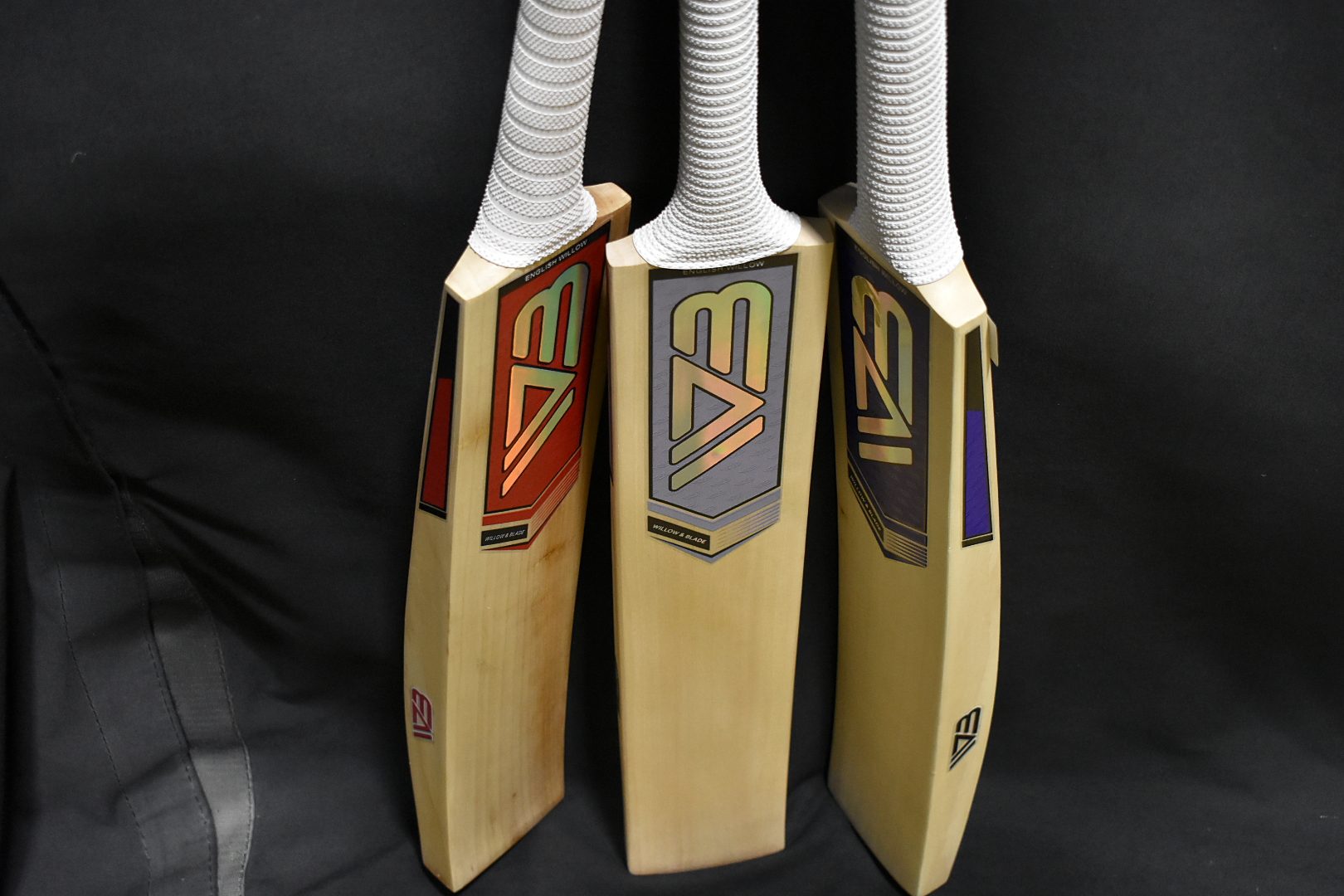 Three Willow & Blade bats leaning together