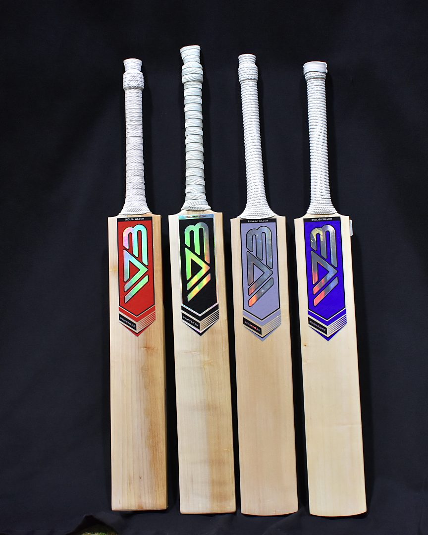 Four Willow & Blade bats on a black background